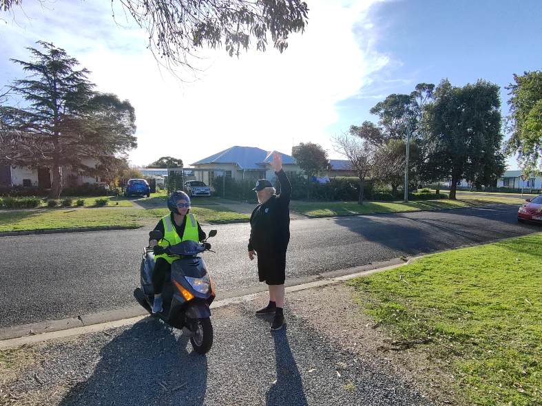 Bec on the scooter while i try and work the drone with hand signals