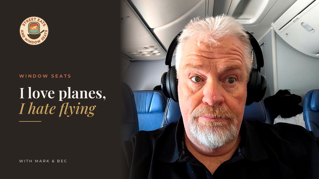 mark sitting on an aeroplane