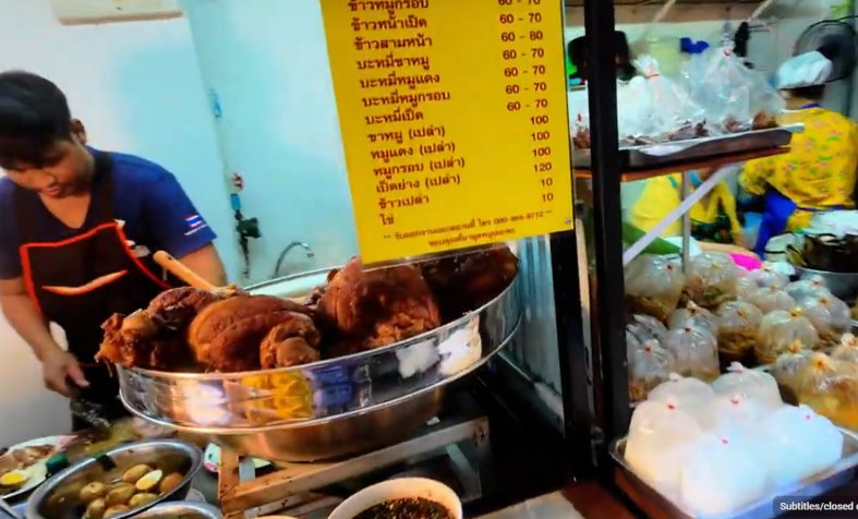 Pork knuckle boiling in a street food alley in Bangkok Thailand