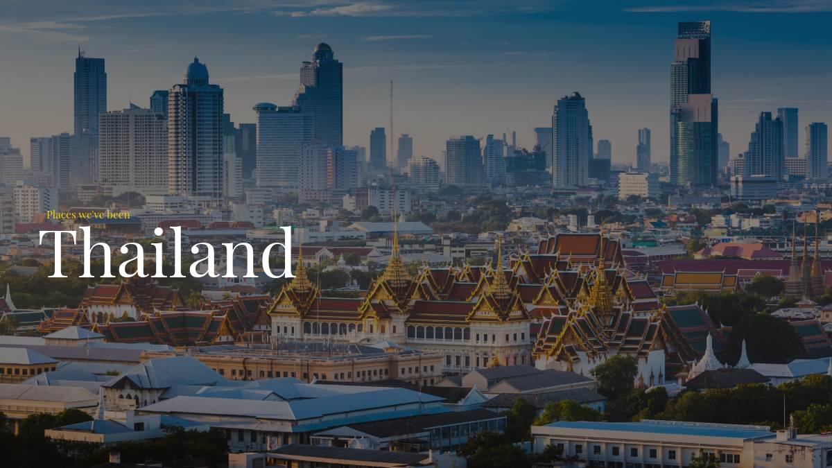 an elevated view of bangkok showing high rises and temples