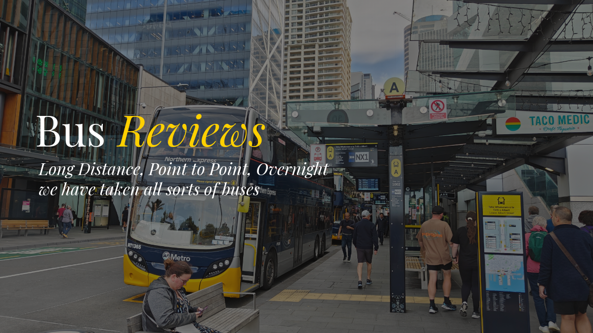 A bus on the street in Auckland New Zealand with people waiting to board