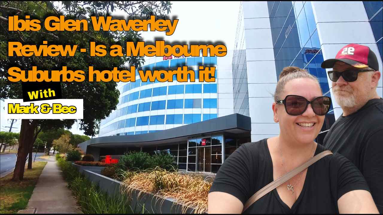 Ibis Glen Waverley Review — is a Melbourne suburbs hotel worth it — Mark and Bec smiling in front of the Ibis Glen Waverley hotel exterior