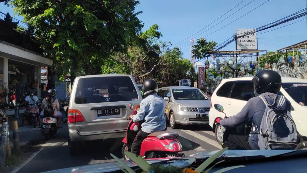 Traffic congestion on the roads in Bali Indonesia with cars and motorbikes bumper to bumper