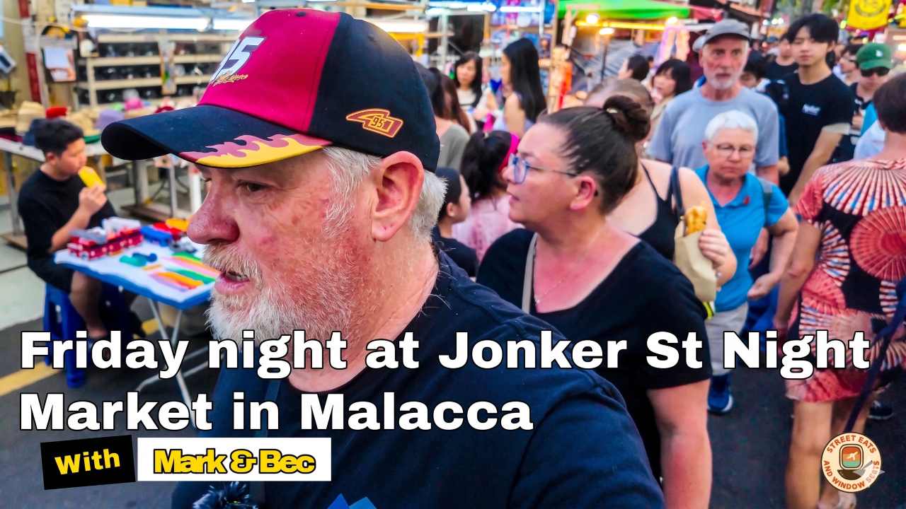 Mark and Bec walking down Jonker street in Melaka.